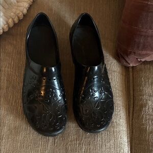 Dansko Black Embossed Slip-On Clogs